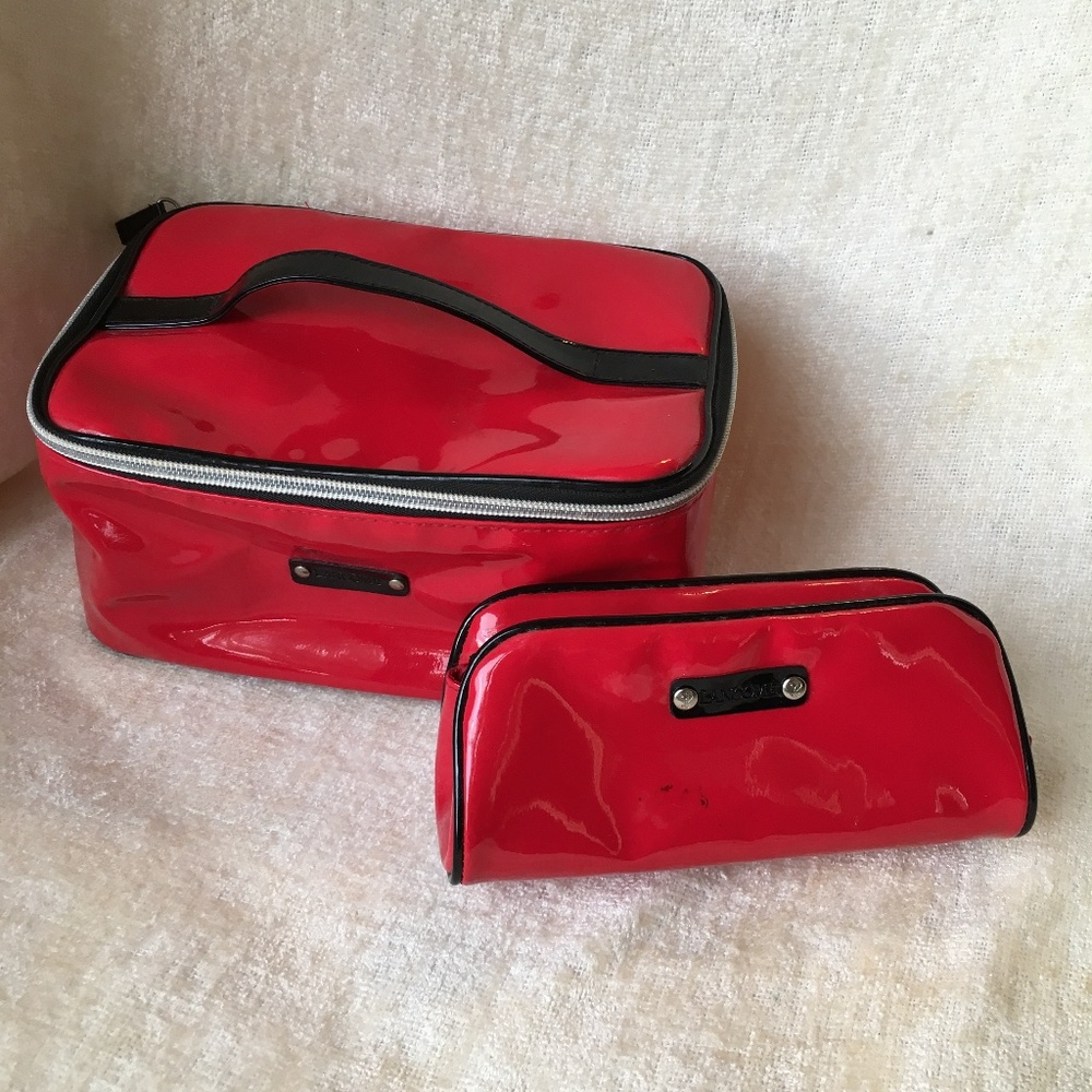 Lancome set of two red cosmetic travel bags/ cases.
